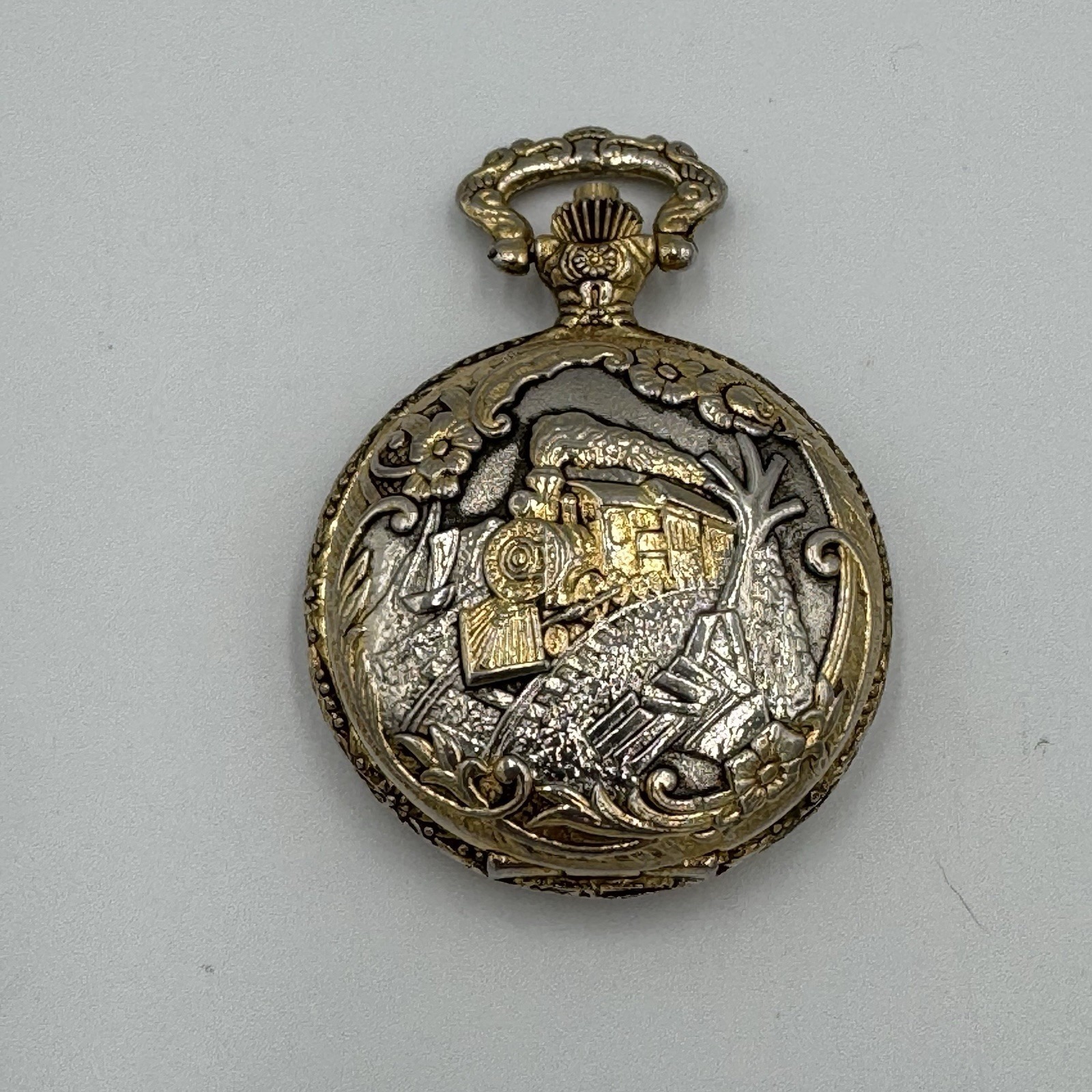 Vintage GoldTone Pocket Watch Featuring An Engraved Locomotive Train Pendant 3d